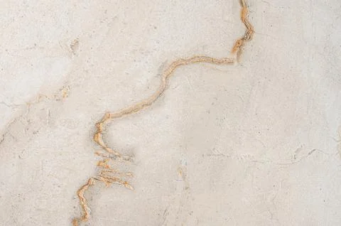 A beige marble background with subtle brown veining and a natural stone tex.. 写真素材