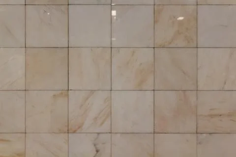 Beige marble tile wall texture with natural stone pattern and smooth surface Stock Photos