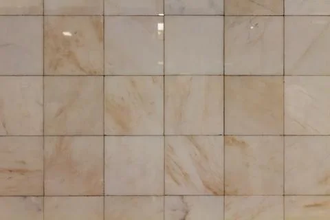 Beige marble tile wall texture with natural stone pattern and soft neutral Stock Photos
