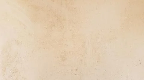 Beige matt plaster wall close-up. Decorative Venetian plaster Stockfoto's