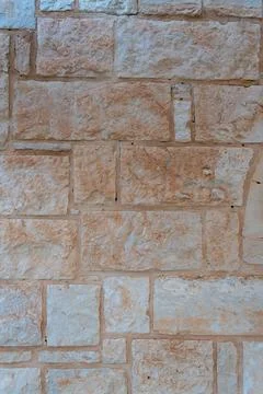 Beige natural stone wall texture background closeup Fotos Stock