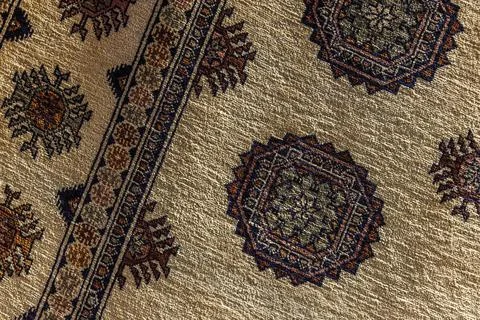 Beige oriental silk carpet pattern, close up Stock Photos