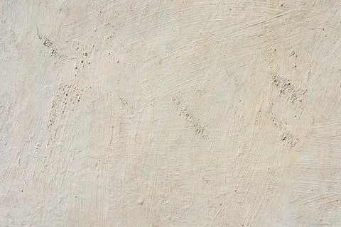 Beige painted wall texture with rough brush strokes and coarse plaster surfac Stock Photos