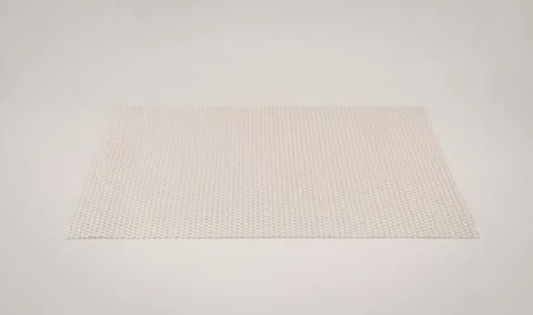Beige perforated baking sheet for cooking Stock Photos
