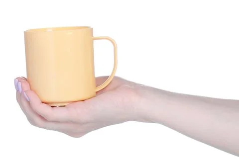 Beige plastic cup mug in hand Stock Photos