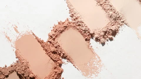 Beige powder smears in dynamic light on white surface Stock Footage 342564650