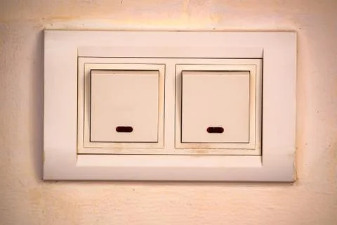 Beige rocker light switch with two buttons Foto stock