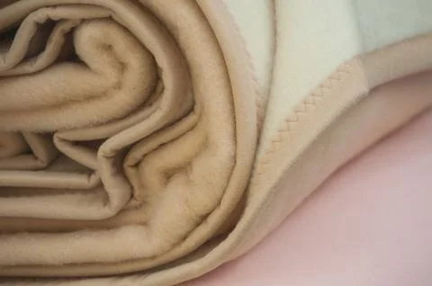 Beige rolled blanket texture Stock Photos