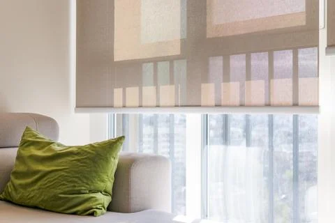 Beige roller blind on large window Stock Photos