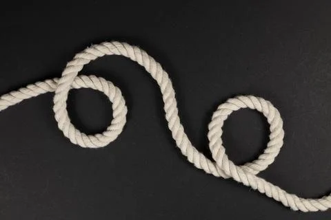 Beige rope on dark background close up Foto stock
