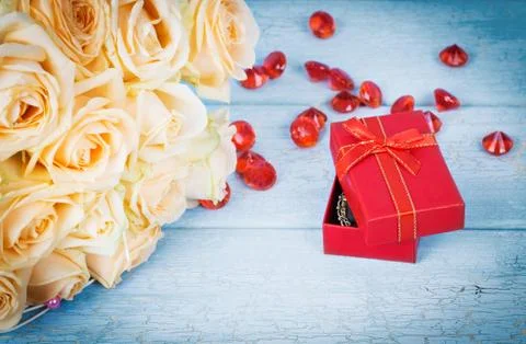 Beige roses with gift Stock Photos