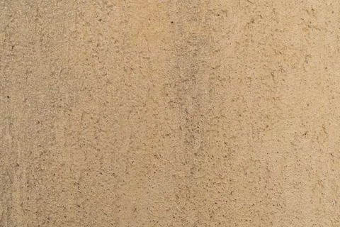 Beige rough concrete surface texture with fine details and subtle patterns 스톡 사진