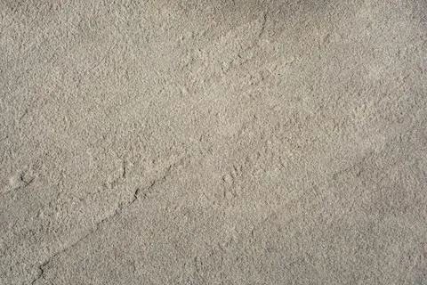 Beige sandstone texture background with rough natural grain surface Fotos de archivo