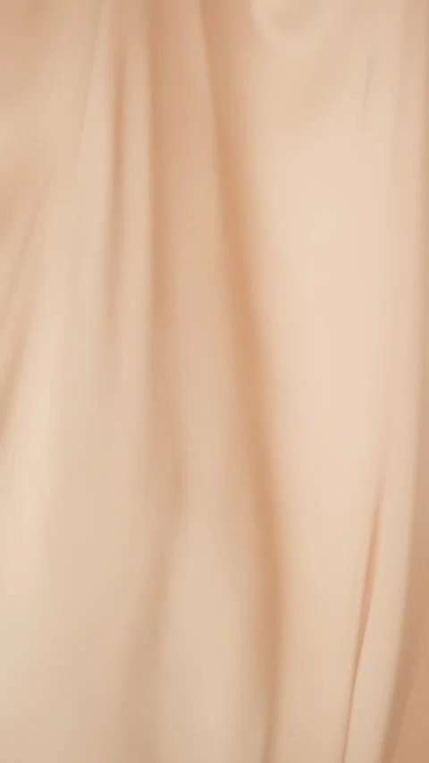 Beige silk fabric flutters in the wind. Light curtains, vertical video Stock Footage 276918227