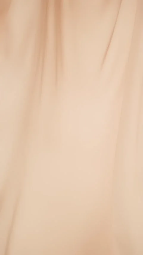 Beige silk fabric flutters in the wind. Light curtains, vertical video Stock Footage 276918248