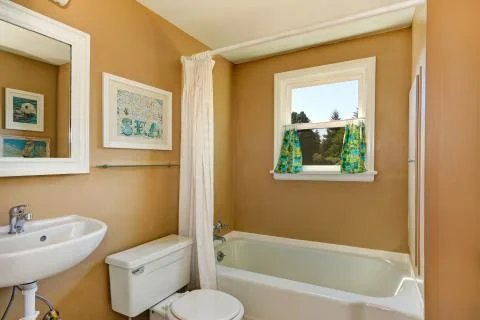 Beige simple bathroom with window Stock Photos