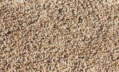 Beige small pebbles Stock Photos