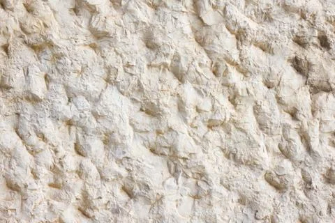Beige smooth stone wall texture Stock Photos