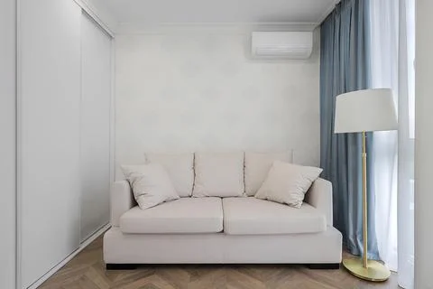 Beige sofa in the room interior Stock Photos