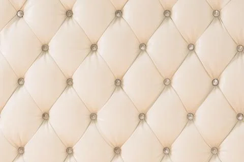 Beige soft tapestry pattern background with symmetrical buttons on the corners Stock Photos