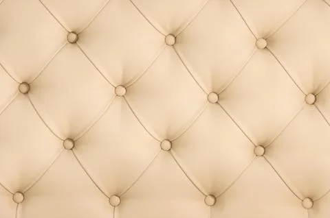 Beige soft tapestry pattern background with symmetrical buttons on the corners Stock Photos