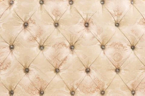 Beige soft tapestry pattern background with symmetrical buttons on the corners Stock Photos