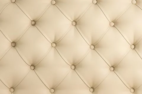 Beige soft tapestry pattern background with symmetrical buttons on the corner Stock Photos