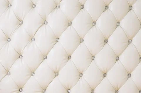 Beige soft tapestry pattern background with symmetrical buttons on the corners Stock Photos