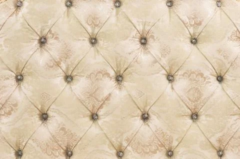 Beige soft tapestry pattern background with symmetrical buttons on the corners Stock Photos