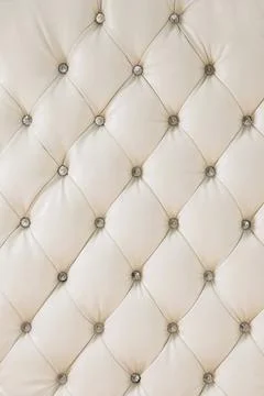 Beige soft tapestry pattern background with symmetrical buttons on the corners Stock Photos