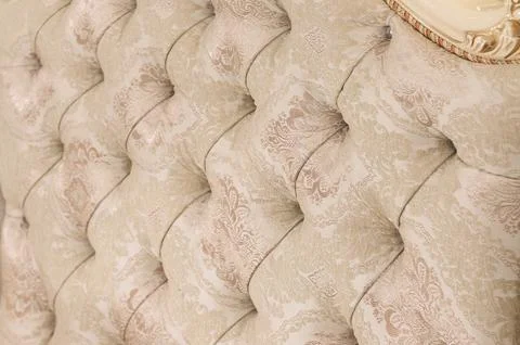 Beige soft tapestry pattern background with symmetrical buttons on the corners Stock Photos