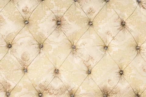 Beige soft tapestry pattern background with symmetrical buttons on the corners Stock Photos
