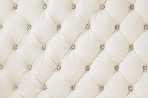 Beige soft tapestry pattern background with symmetrical buttons on the corners Stock Photos