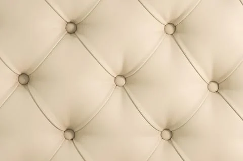Beige soft tapestry pattern background with symmetrical buttons on the corners Stock Photos