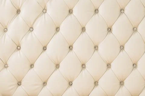 Beige soft tapestry pattern background with symmetrical buttons on the corners Stock Photos