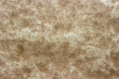 Beige stone plastered surface Stock Photos