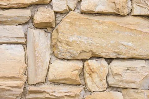 Beige stone wall. Stock Photos