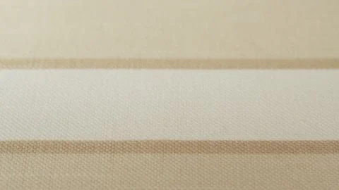 Beige striped fabric close-up, light brown cloth texture background. Macro Stock Footage 169114856