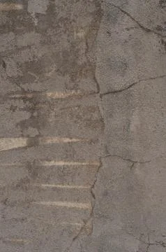 Beige stucco sandy surface worn, cracked, and faded Stock Photos