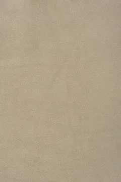 Beige suede background as a material for designers. Suede texture. Stock Photos