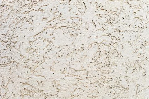 Beige surface plaster with relief texture at bark beetle style Stock Photos