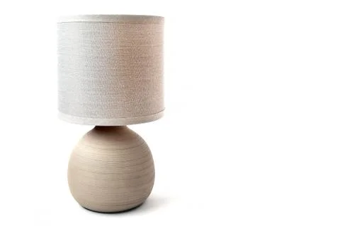 Beige table lamp on a white background. Beautiful lamp Stock Photos