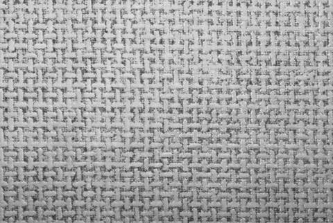 Beige texture in twisted mesh.Background of t-shaped symbols. Stock Photos