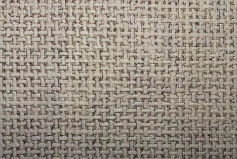 Beige texture in twisted mesh.Background of t-shaped symbols. Stock Photos