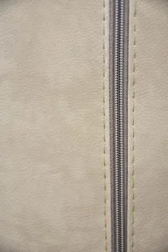 Beige texture with zipper Stock Photos