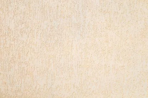 Beige textured plaster wall with vertical stucco pattern for background and Foto stock