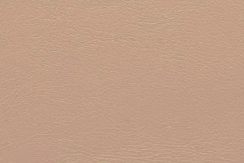 Beige textured surface with a subtle grain pattern, resembling leather or v.. Stock Photos