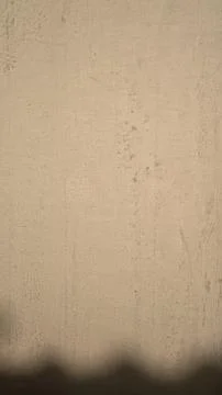 Beige textured wall background with soft shadow Stock Photos