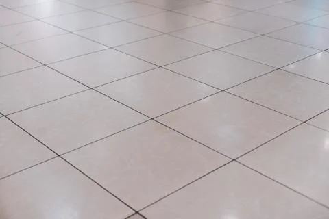 Beige tile on the floor in perspective Stock Photos