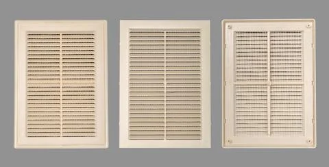 Beige ventilation grate on a gray background. Rectangle shape, plastic materi Stock Photos